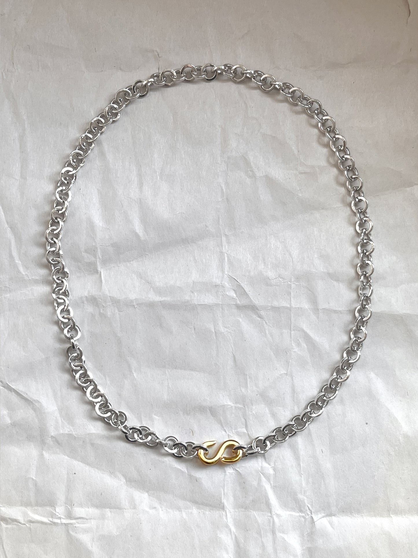 Laura Lombardi Two Tone Colonna chain necklace on a white paper background.