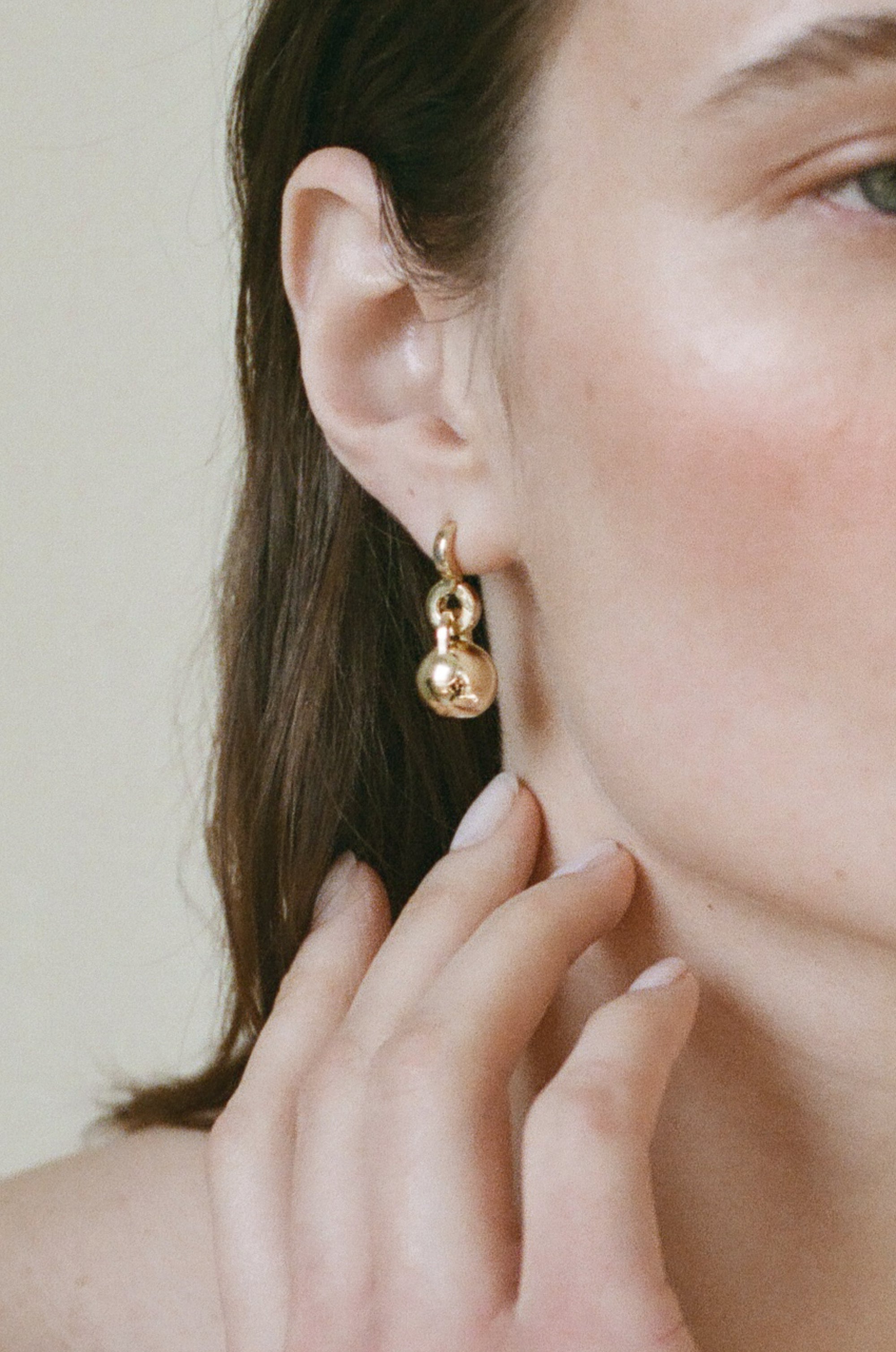 Model wearing Laura Lombardi gold Gioca Earrings