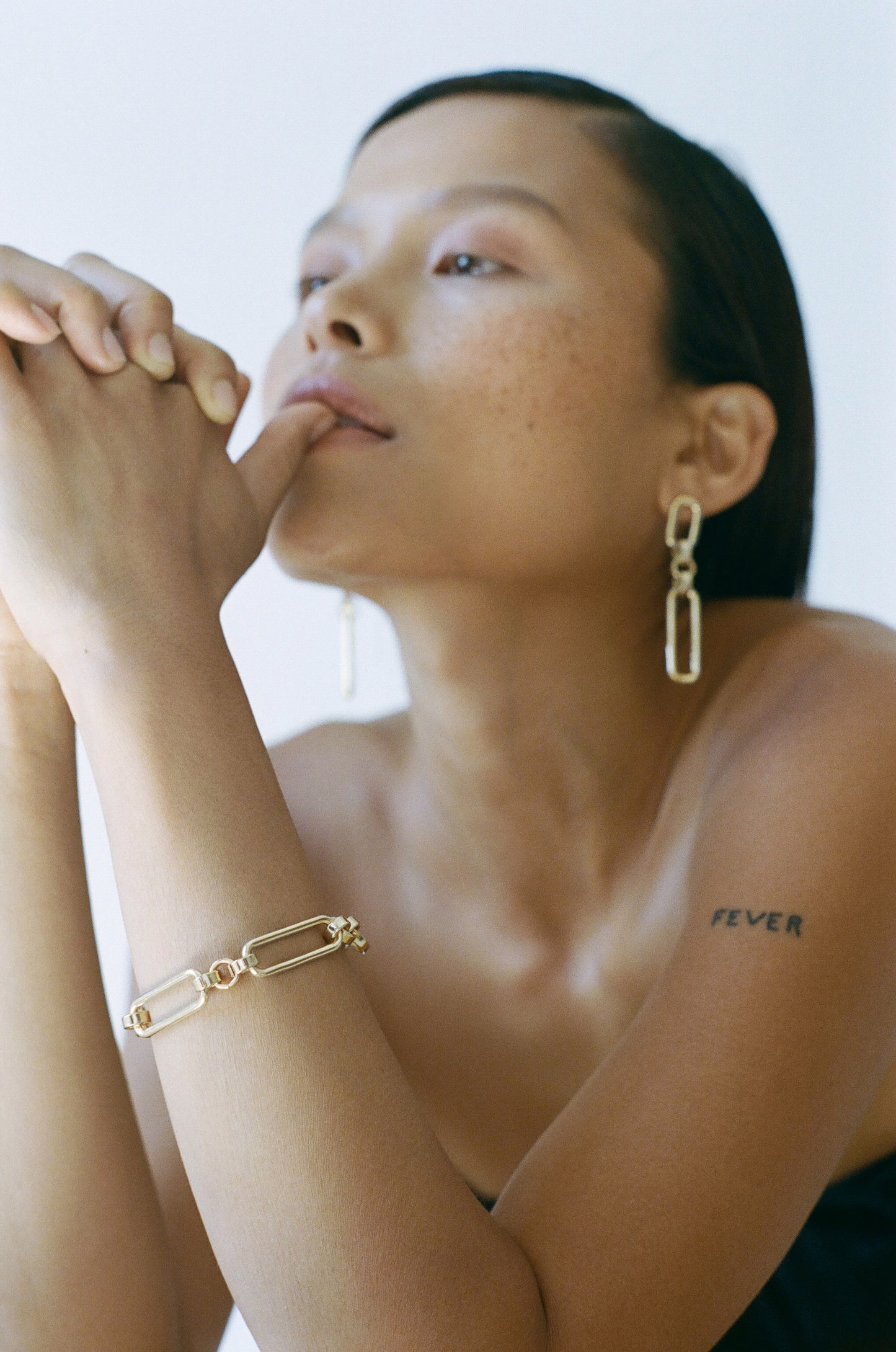 Model wearing Laura Lombardi gold Stanza Bracelet.