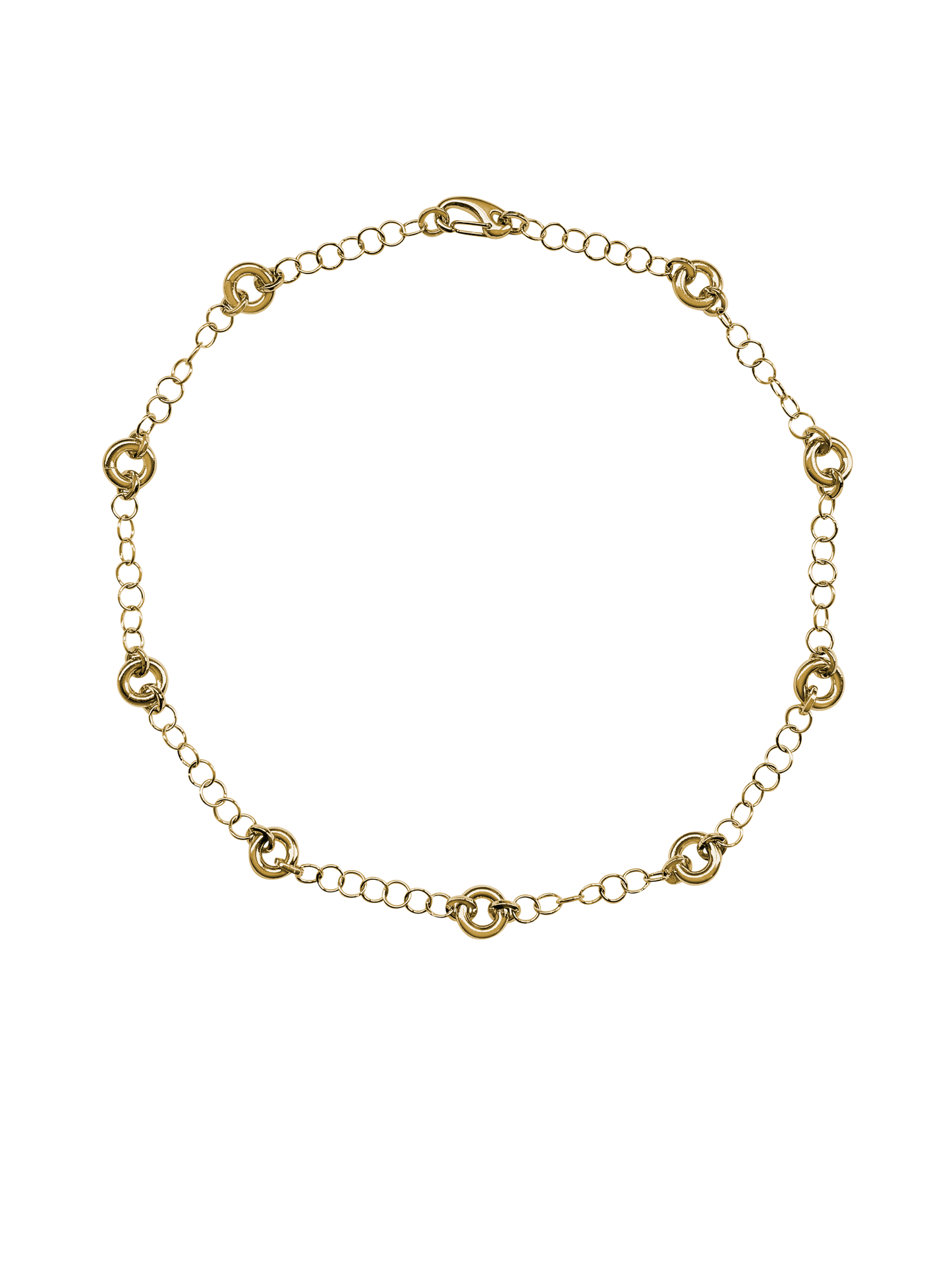 The Astra Necklace, a delicate cable chain with circular link accents in gold.