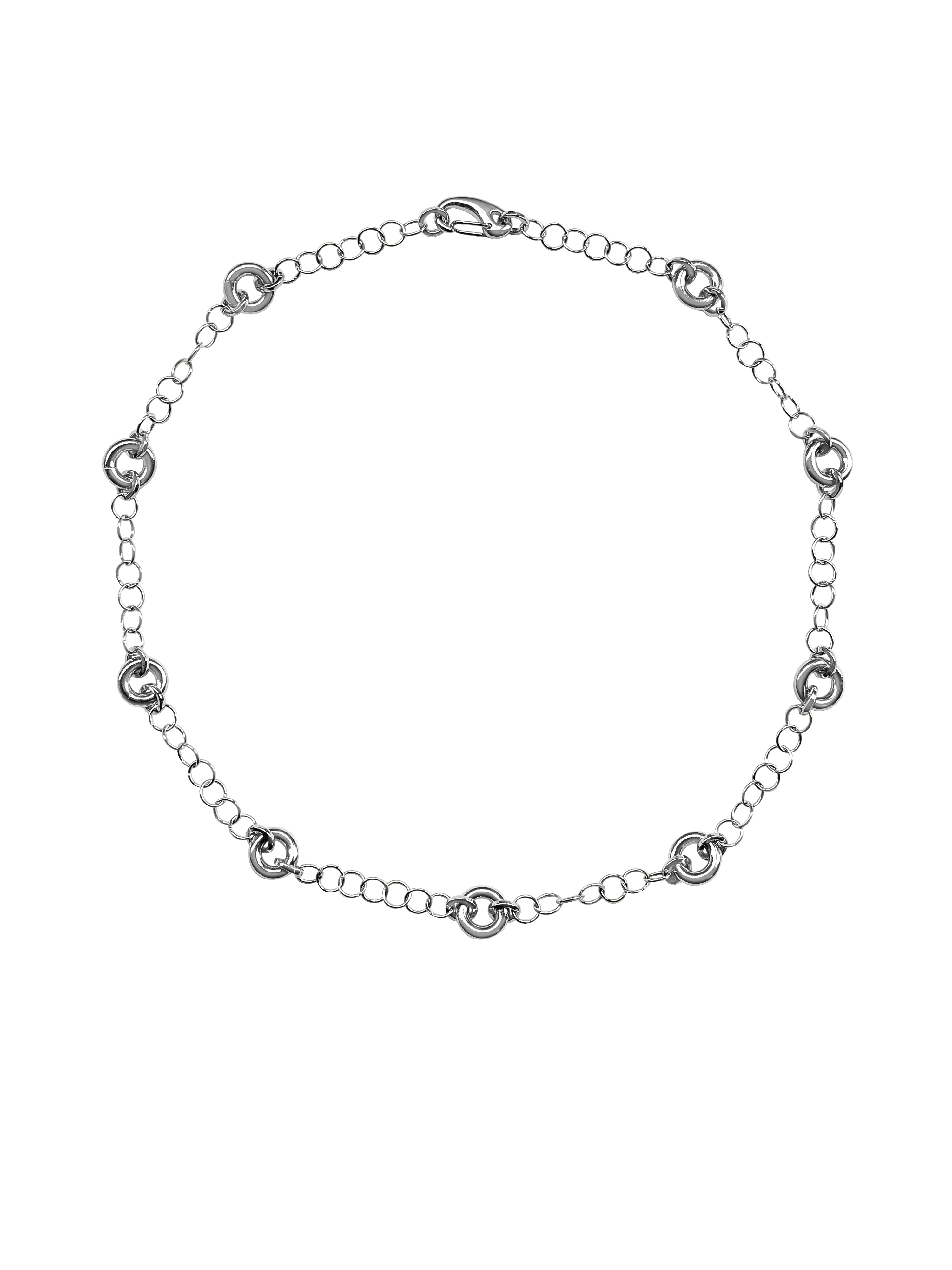 The Astra Necklace, a delicate cable chain with circular link accents in silver.