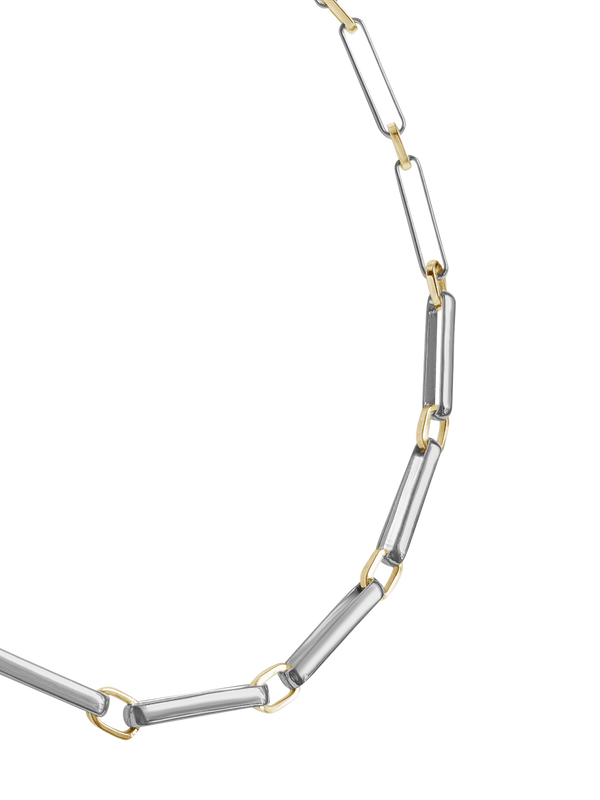 A two-tone chain link necklace featuring silver-toned rectangular links and gold-toned square accents, arranged in a circular shape on a transparent background.