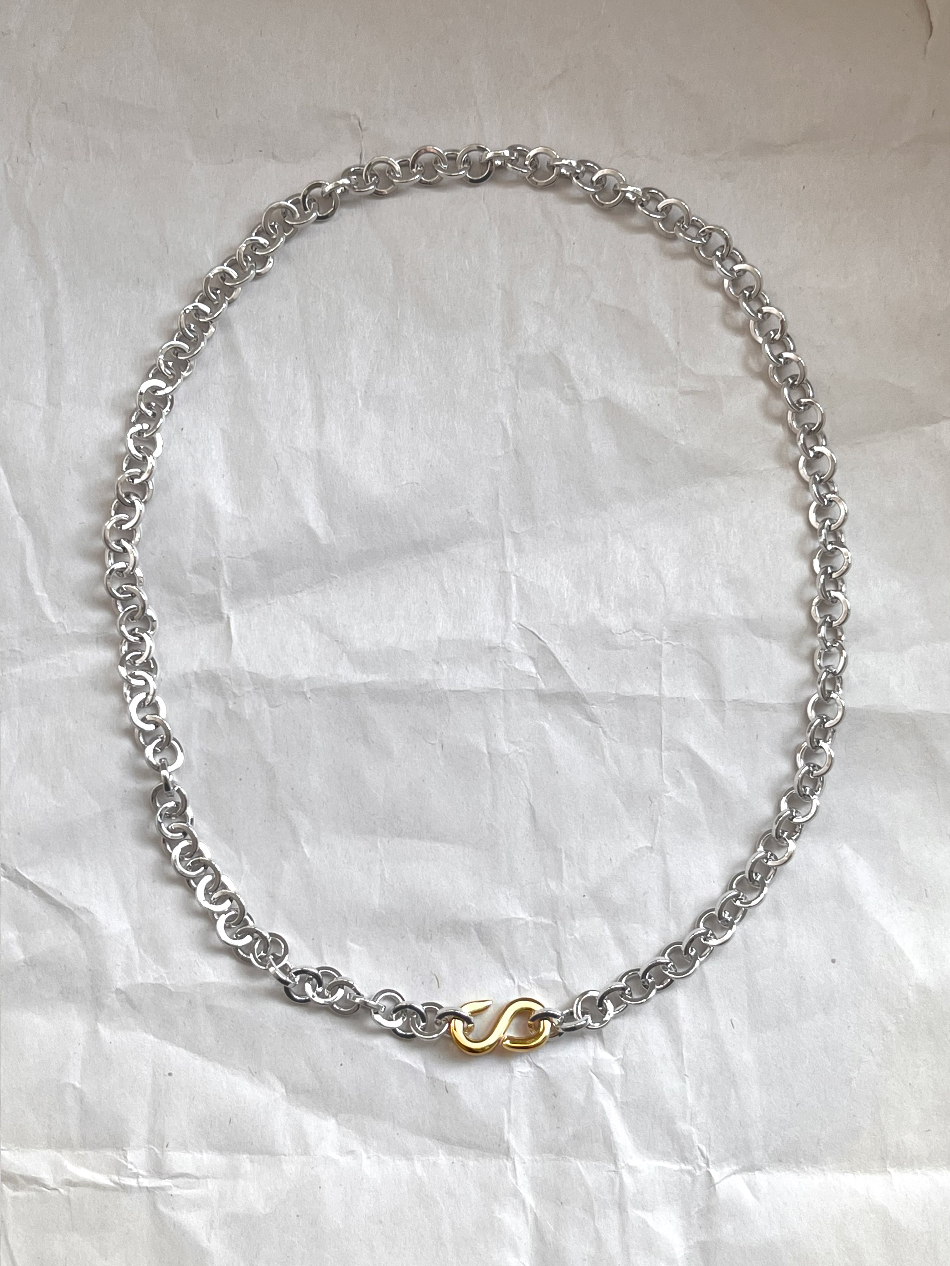 Laura Lombardi Two Tone Colonna chain necklace on a white paper background.