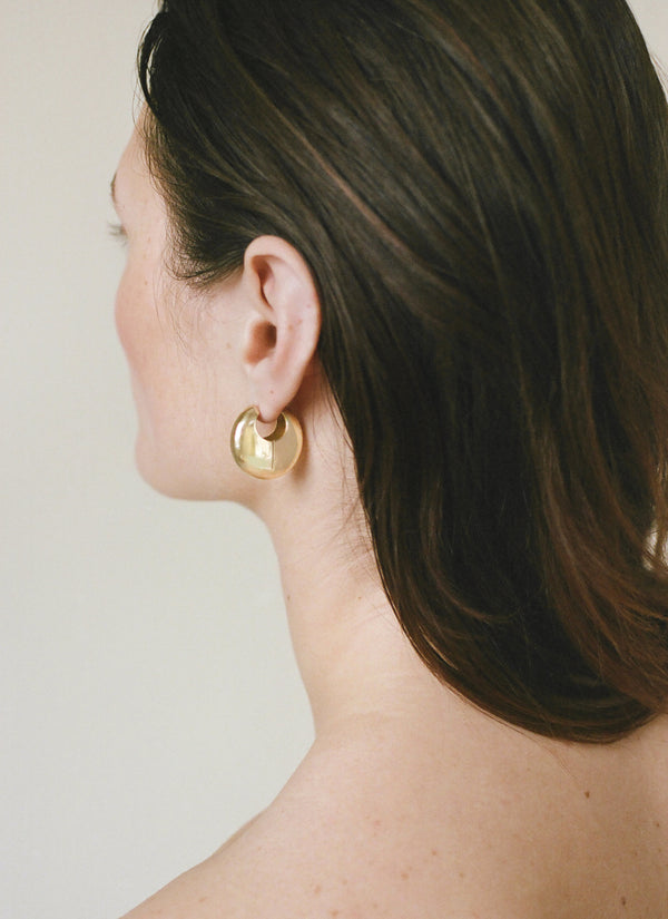 Model wearing Laura Lombardi gold Ferma Earrings