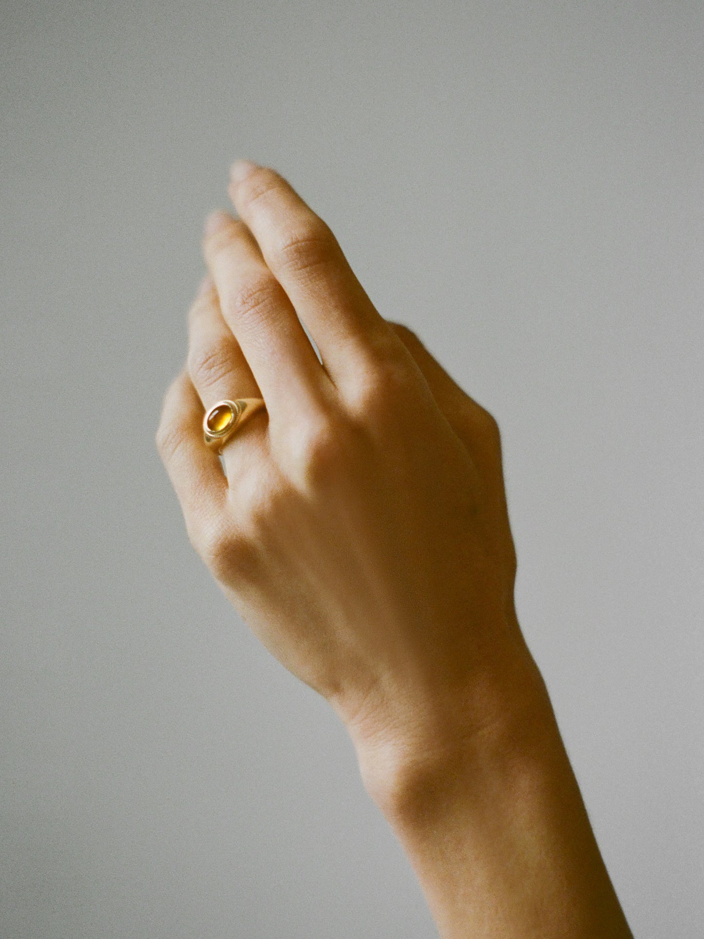 Model wearing Laura Lombardi gold Ginerva Ring with Citrine stone.