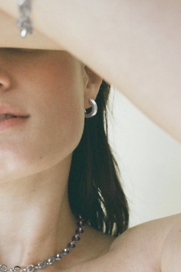Model wearing Laura Lombardi Silver Persa Earrings
