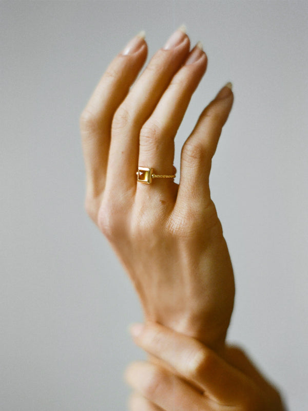 Model wearing Laura Lombardi gold Quadro Ring with yellow citrine stone.