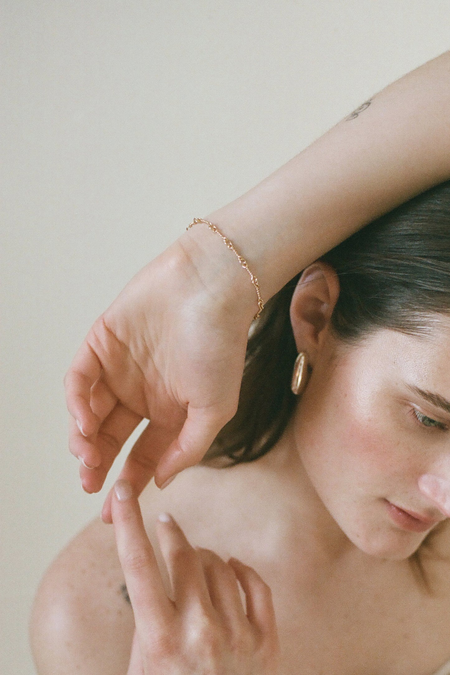 Model wearing Laura Lombardi gold Riccio Bracelet